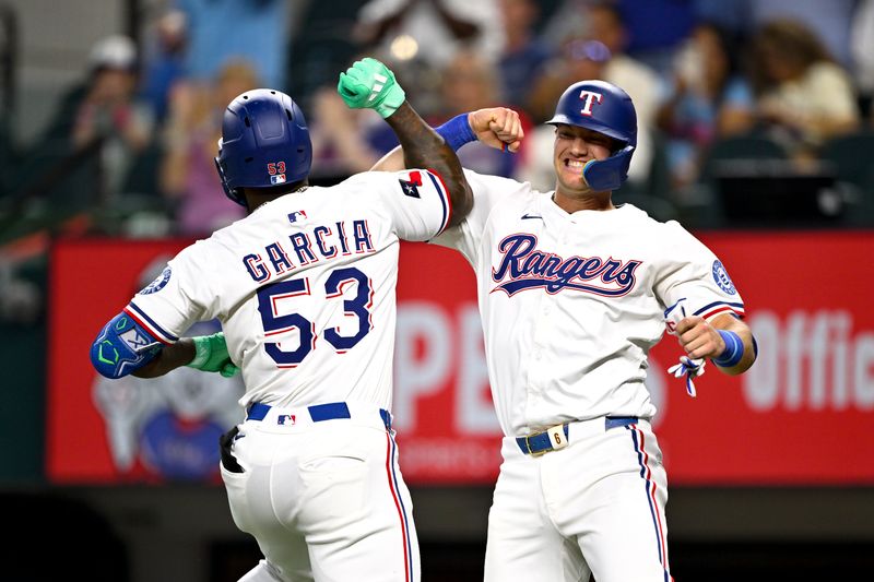 Aug 23, 2025; Arlington, Texas, USA; Texas Rangers right fielder Adolis Garcia (53) and third baseman Josh Jung (6) celebrate a two run home run hit by Garcia against the Cleveland Guardians during the fifth inning at Globe Life Field. Mandatory Credit: Jerome Miron-Imagn Images