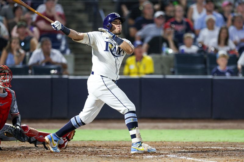 May 26, 2025; Tampa, Florida, USA; Tampa Bay Rays first baseman Jonathan Aranda (62) hits a three run home run against the Minnesota Twins in the sixth inning at George M. Steinbrenner Field. Mandatory Credit: Nathan Ray Seebeck-Imagn Images