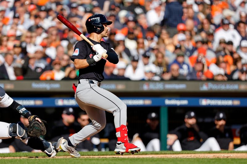 Oct 9, 2024; Detroit, Michigan, USA; Cleveland Guardians outfielder Steven Kwan (38) hits a single against the Detroit Tigers during the third inning during game three of the ALDS for the 2024 MLB Playoffs at Comerica Park. Mandatory Credit: Rick Osentoski-Imagn Images