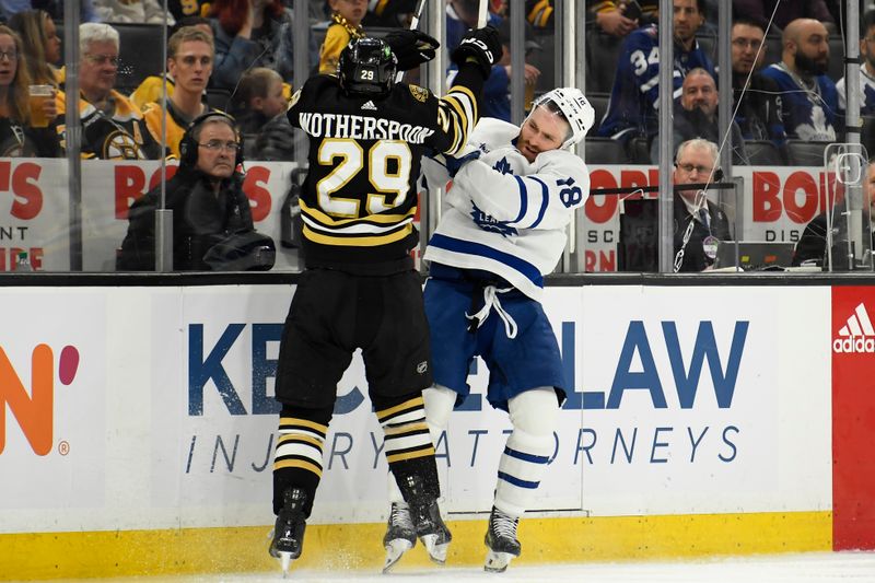 May 4, 2024; Boston, Massachusetts, USA; Boston Bruins defenseman Parker Wotherspoon (29) checks Toronto Maple Leafs center Noah Gregor (18) during the second period in game seven of the first round of the 2024 Stanley Cup Playoffs at TD Garden. Mandatory Credit: Bob DeChiara-USA TODAY Sports