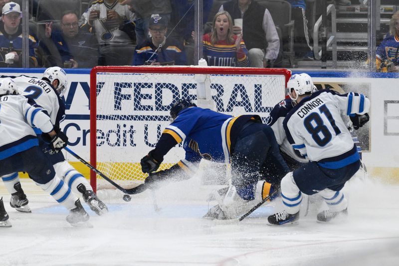 Apr 27, 2025; St. Louis, Missouri, USA; St. Louis Blues center Robert Thomas (18) scores a goal against the Winnipeg Jets during the third period in game four of the first round of the 2025 Stanley Cup Playoffs at Enterprise Center. Mandatory Credit: Jeff Le-Imagn Images