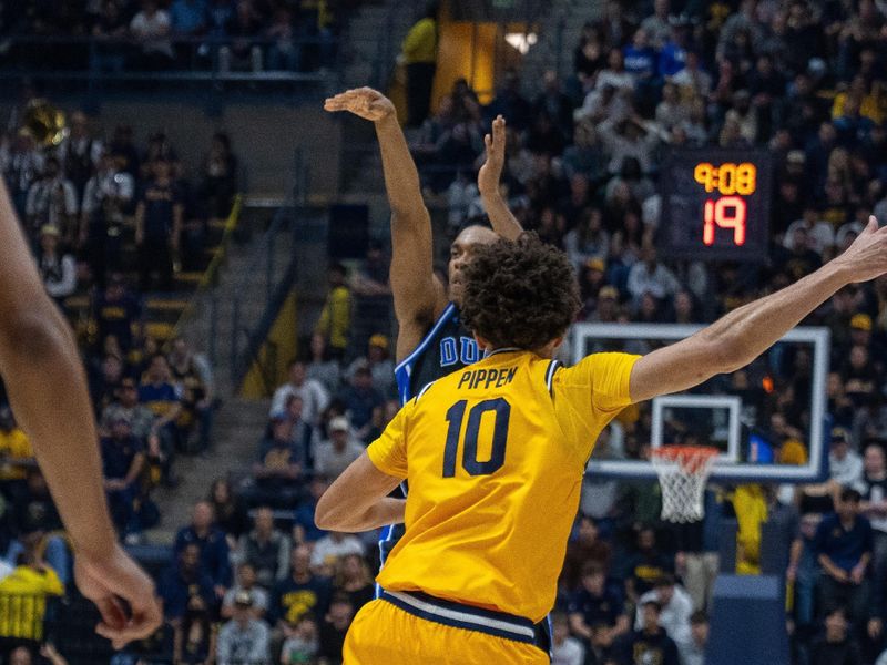 Jan 14, 2026; Berkeley, California, USA; Duke Blue Devils guard Caleb Foster (1) makes a three point basket against California Golden Bears guard Justin Pippen (10) during the first half at Haas Pavilion. Mandatory Credit: Neville E. Guard-Imagn Images