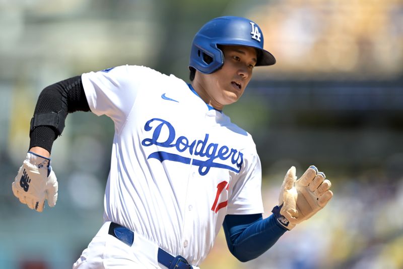 Apr 17, 2024; Los Angeles, California, USA; Los Angeles Dodgers designated hitter player Shohei Ohtani (17) runs to third on a ground out by first base Freddie Freeman (5) in the eighth inning against the Washington Nationals at Dodger Stadium. Mandatory Credit: Jayne Kamin-Oncea-USA TODAY Sports