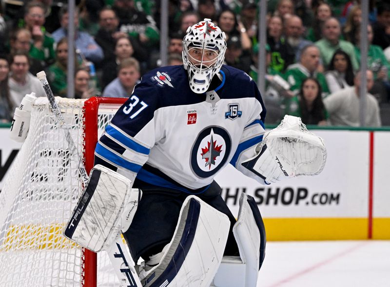 Feb 2, 2026; Dallas, Texas, USA; Winnipeg Jets goaltender Connor Hellebuyck (37) faces the Dallas Stars attack during the second period at the American Airlines Center. Mandatory Credit: Jerome Miron-Imagn Images