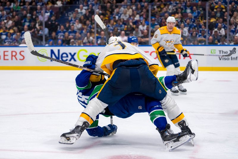 Apr 23, 2024; Vancouver, British Columbia, CAN; Nashville Predators defenseman Jeremy Lauzon (3) checks Vancouver Canucks forward Sam Lafferty (18) during the third period in game two of the first round of the 2024 Stanley Cup Playoffs at Rogers Arena. Mandatory Credit: Bob Frid-USA TODAY Sports