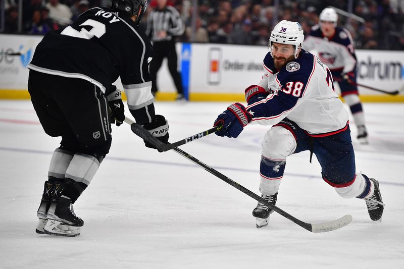 Mar 16, 2023; Los Angeles, California, USA; Columbus Blue Jackets center Boone Jenner (38) shoots against Los Angeles Kings defenseman Matt Roy (3) during the third period at Crypto.com Arena. Mandatory Credit: Gary A. Vasquez-USA TODAY Sports