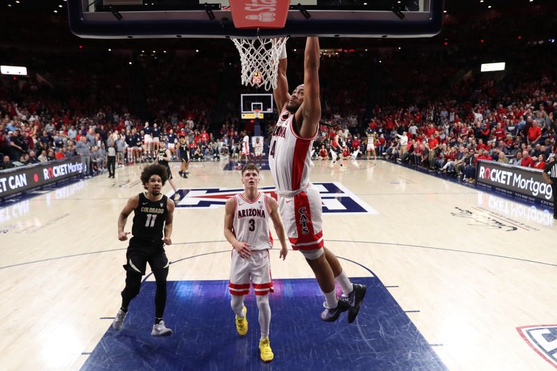 Feb 18, 2023; Tucson, Arizona, USA; Arizona Wildcats guard Pelle Larsson (3) drives to the net with guard Kylan Boswell (4) making a basket against Colorado Buffaloes guard Javon Ruffin (11)  during the first half at McKale Center. Mandatory Credit: Zachary BonDurant-USA TODAY Sports