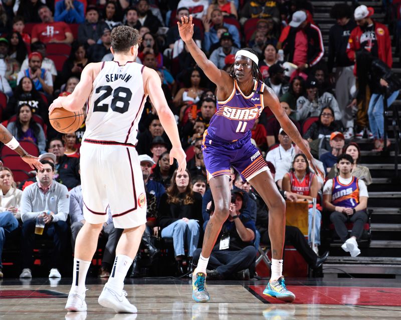 HOUSTON, TX - FEBRUARY 12: Bol Bol #11 of the Phoenix Suns plays defense during the game against the Houston Rockets on February 12, 2025 at the Toyota Center in Houston, Texas. NOTE TO USER: User expressly acknowledges and agrees that, by downloading and or using this photograph, User is consenting to the terms and conditions of the Getty Images License Agreement. Mandatory Copyright Notice: Copyright 2025 NBAE (Photo by Logan Riely/NBAE via Getty Images)