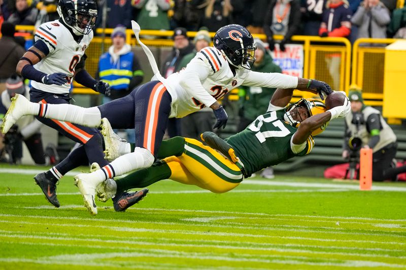 Chicago Bears' Tyrique Stevenson knocks the ball from Green Bay Packers' Romeo Doubs in the endzone during the first half of an NFL football game Sunday, Jan. 7, 2024, in Green Bay, Wis. (AP Photo/Morry Gash)