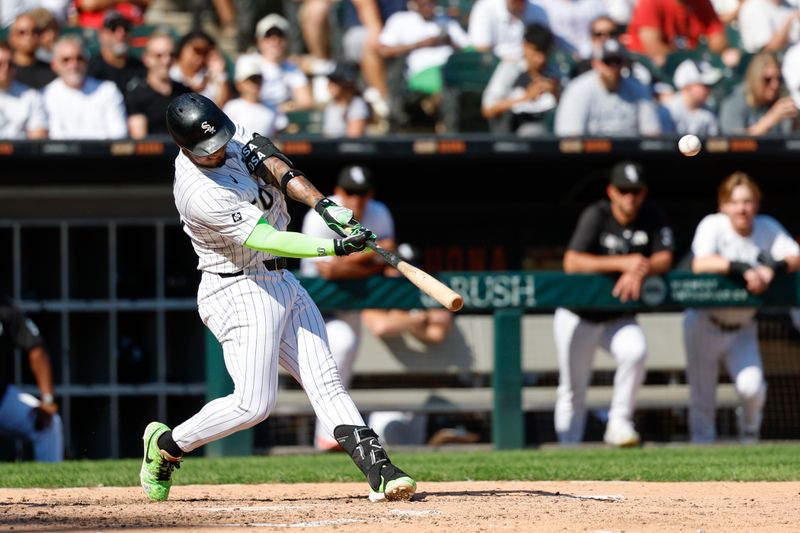 Aug 31, 2025; Chicago, Illinois, USA; Chicago White Sox first baseman Lenyn Sosa (50) hits a solo home run against the New York Yankees during the eight inning at Rate Field. Mandatory Credit: Kamil Krzaczynski-Imagn Images