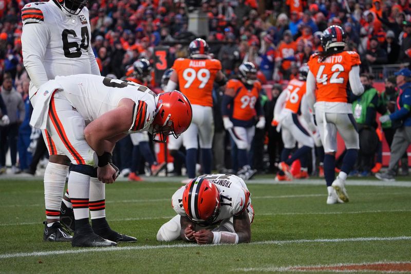 Cleveland Browns quarterback Dorian Thompson-Robinson (17) gets injured against the Denver Broncos of an NFL football game Sunday November 26, 2023, in Denver. (AP Photo/Bart Young)