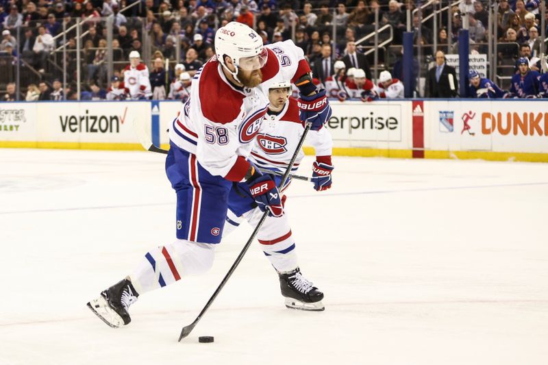 Apr 7, 2024; New York, New York, USA;  Montreal Canadiens defenseman David Savard (58) attempts a shot on goal in the first period against the New York Rangers at Madison Square Garden. Mandatory Credit: Wendell Cruz-USA TODAY Sports