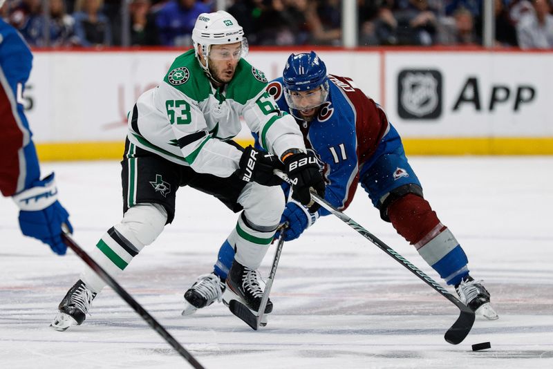 May 13, 2024; Denver, Colorado, USA; Dallas Stars right wing Evgenii Dadonov (63) and Colorado Avalanche center Andrew Cogliano (11) battle for the puck in the third period in game four of the second round of the 2024 Stanley Cup Playoffs at Ball Arena. Mandatory Credit: Isaiah J. Downing-USA TODAY Sports