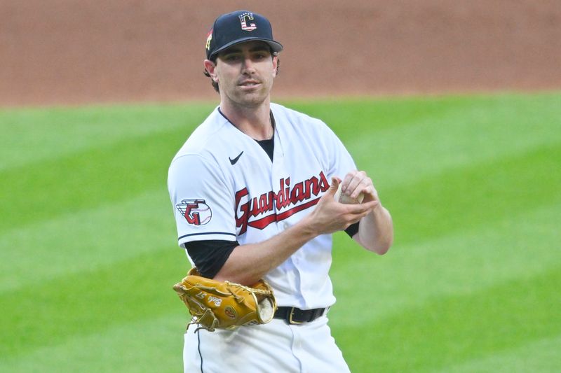 Jul 4, 2023; Cleveland, Ohio, USA; Cleveland Guardians starting pitcher Shane Bieber (57) reacts after giving up a home run in the fifth inning against the Atlanta Braves at Progressive Field. Mandatory Credit: David Richard-USA TODAY Sports