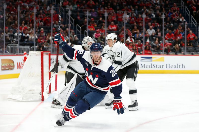 Jan 7, 2024; Washington, District of Columbia, USA; Washington Capitals right wing Nic Dowd (26) celebrates after scoring a goal past Los Angeles Kings goaltender Cam Talbot (39) during the second period at Capital One Arena. Mandatory Credit: Amber Searls-USA TODAY Sports