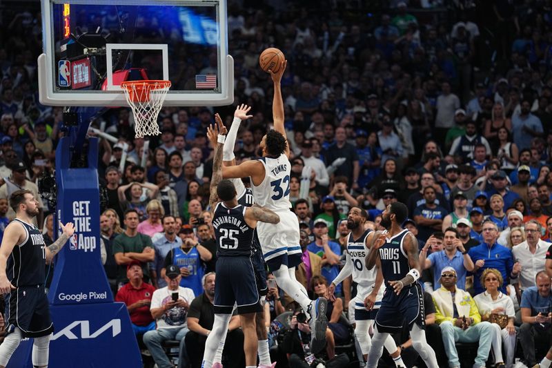 DALLAS, TX - MAY 28: Karl-Anthony Towns #32 of the Minnesota Timberwolves drives to the basket during the game against the Dallas Mavericks during Game 4 of the Western Conference Finals of the 2024 NBA Playoffs on May 28, 2024 at the American Airlines Center in Dallas, Texas. NOTE TO USER: User expressly acknowledges and agrees that, by downloading and or using this photograph, User is consenting to the terms and conditions of the Getty Images License Agreement. Mandatory Copyright Notice: Copyright 2024 NBAE (Photo by Glenn James/NBAE via Getty Images)