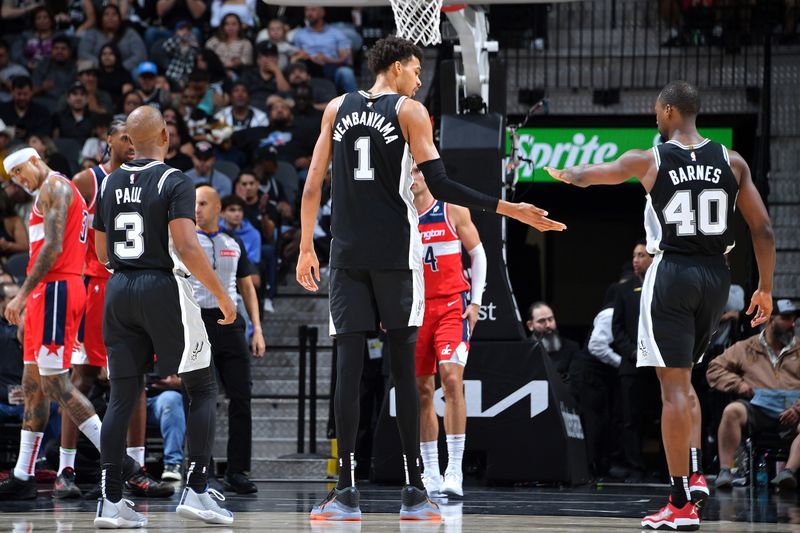 SAN ANTONIO, TX - NOVEMBER 13: Victor Wembanyama #1 and Harrison Barnes #40 of the San Antonio Spurs high five during the game against the Washington Wizards on November 13, 2024 at the Frost Bank Center in San Antonio, Texas. NOTE TO USER: User expressly acknowledges and agrees that, by downloading and or using this photograph, user is consenting to the terms and conditions of the Getty Images License Agreement. Mandatory Copyright Notice: Copyright 2024 NBAE (Photos by Michael Gonzales/NBAE via Getty Images)