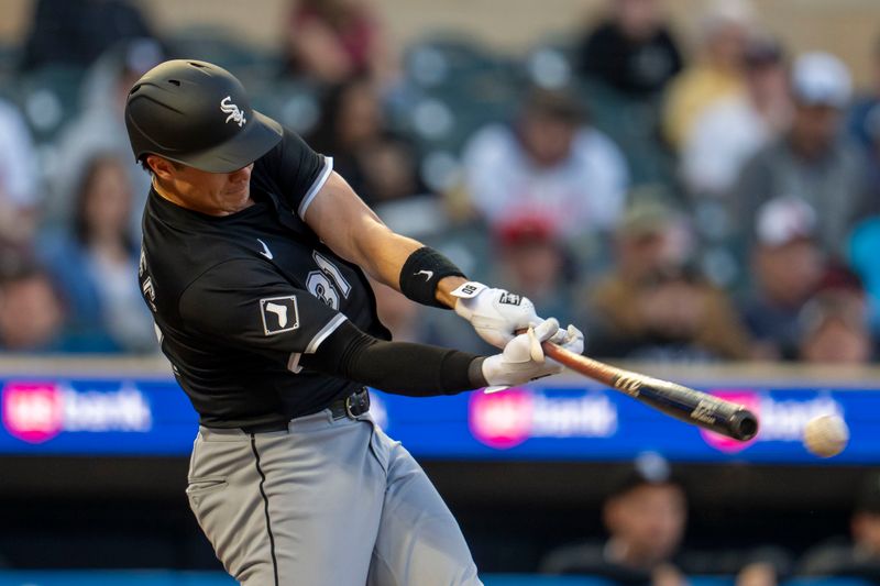 Apr 22, 2025; Minneapolis, Minnesota, USA; Chicago White Sox third baseman Bobby Dalbec (31) hits a double against the Minnesota Twins in the fourth inning at Target Field. Mandatory Credit: Jesse Johnson-Imagn Images