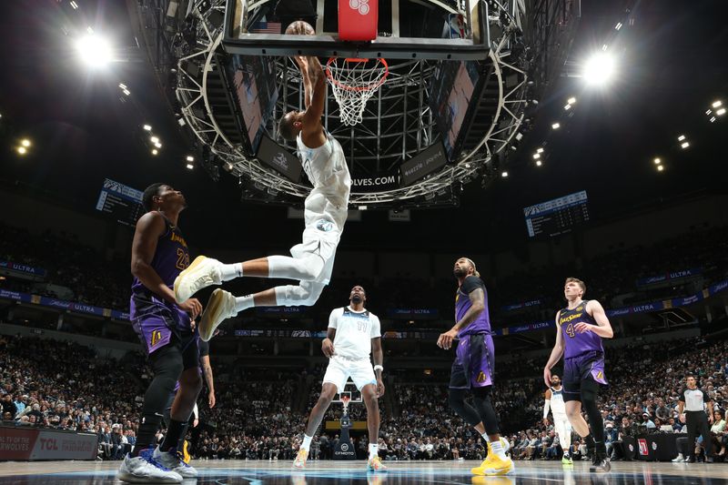 MINNEAPOLIS, MN -  DECEMBER 2: Rudy Gobert #27 of the Minnesota Timberwolves drives to the basket during the game against the Los Angeles Lakers on December 2, 2024 at Target Center in Minneapolis, Minnesota. NOTE TO USER: User expressly acknowledges and agrees that, by downloading and or using this Photograph, user is consenting to the terms and conditions of the Getty Images License Agreement. Mandatory Copyright Notice: Copyright 2024 NBAE (Photo by David Sherman/NBAE via Getty Images)