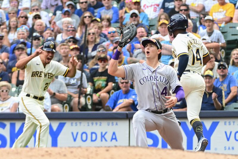 Aug 9, 2023; Milwaukee, Wisconsin, USA; Colorado Rockies first baseman Michael Toglia (4) reacts after a throwing error on a ball hit by Milwaukee Brewers third baseman Andruw Monasterio (14) allows the winning run to score in the tenth inning at American Family Field. Mandatory Credit: Benny Sieu-USA TODAY Sports