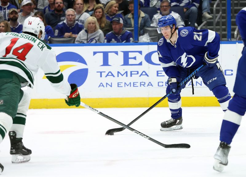 Jan 18, 2024; Tampa, Florida, USA; Tampa Bay Lightning center Brayden Point (21) skates with the puck against the Minnesota Wild during the first period at Amalie Arena. Mandatory Credit: Kim Klement Neitzel-USA TODAY Sports