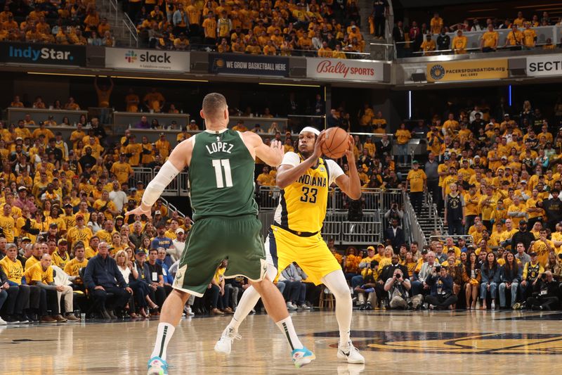 INDIANAPOLIS, IN - APRIL 26: Myles Turner #33 of the Indiana Pacers handles the ball during the game against the Milwaukee Bucks during Round 1 Game 3 of the 2024 NBA Playoffs on April 26, 2024 at Gainbridge Fieldhouse in Indianapolis, Indiana. NOTE TO USER: User expressly acknowledges and agrees that, by downloading and or using this Photograph, user is consenting to the terms and conditions of the Getty Images License Agreement. Mandatory Copyright Notice: Copyright 2023 NBAE (Photo by Nathaniel S. Butler/NBAE via Getty Images)