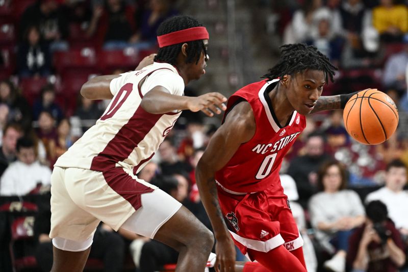 Feb 11, 2023; Chestnut Hill, Massachusetts, USA; North Carolina State Wolfpack guard Terquavion Smith (0) drives to the basket against Boston College Eagles guard Chas Kelley (00) during the second half at the Conte Forum. Mandatory Credit: Brian Fluharty-USA TODAY Sports