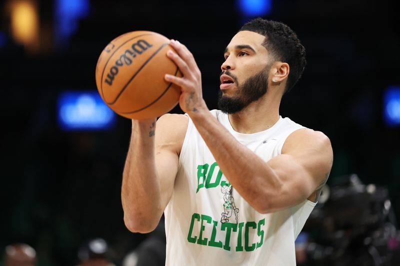 BOSTON, MASSACHUSETTS - FEBRUARY 04: Jayson Tatum #0 of the Boston Celtics warms up before playing a game against the Memphis Grizzlies at TD Garden on February 04, 2024 in Boston, Massachusetts. NOTE TO USER: User expressly acknowledges and agrees that, by downloading and or using this photograph, User is consenting to the terms and conditions of the Getty Images License Agreement. (Photo by Paul Rutherford/Getty Images)