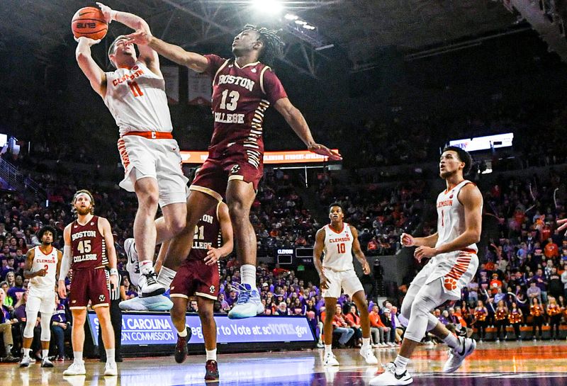 Jan 13, 2024; Clemson, South Carolina, USA; Clemson Tigers guard Joseph Girard III shoots the ball against Boston College Eagles guard Donald Hand (13) during the second half at Littlejohn Coliseum. Mandatory Credit: Ken Ruinard-USA TODAY Sports