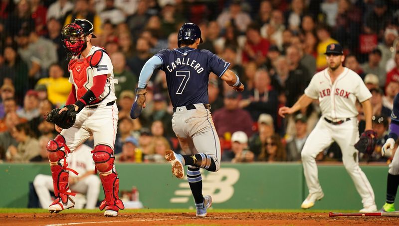 May 13, 2024; Boston, Massachusetts, USA; Tampa Bay Rays shortstop Jose Caballero (7) scores against the Boston Red Sox in the forth inning at Fenway Park. Mandatory Credit: David Butler II-USA TODAY Sports