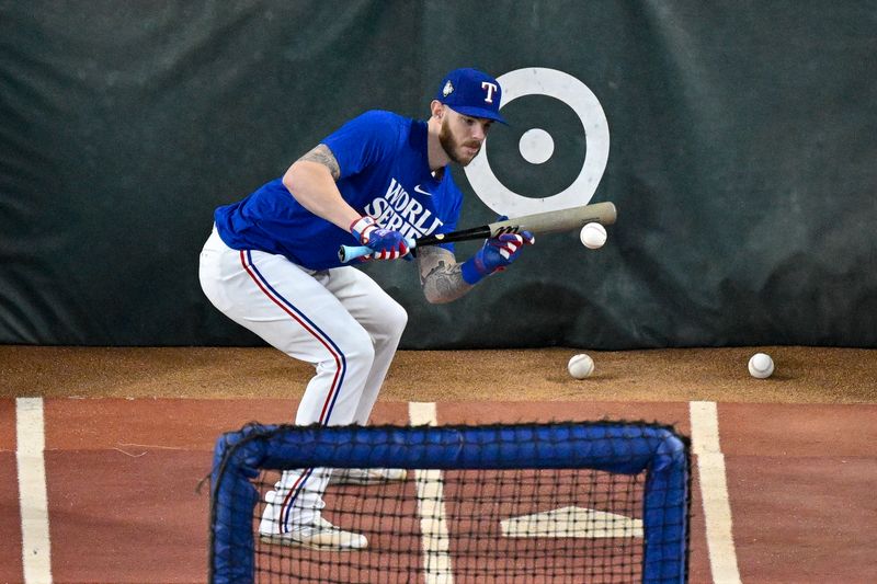 Oct 28, 2023; Arlington, Texas, USA; Texas Rangers catcher Jonah Heim (28) takes batting practice before the game between the Texas Rangers and the Arizona Diamondbacks in game two of the 2023 World Series at Globe Life Field. Mandatory Credit: Jerome Miron-USA TODAY Sports