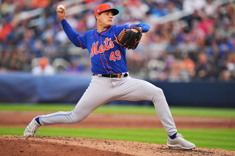 Mar 16, 2024; West Palm Beach, Florida, USA;  New York Mets relief pitcher Yacksel Rios (49) pitches in the third inning against the Houston Astros at CACTI Park of the Palm Beaches. Mandatory Credit: Jim Rassol-USA TODAY Sports