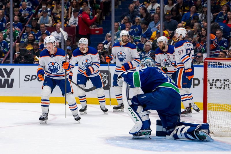 May 20, 2024; Vancouver, British Columbia, CAN; Edmonton Oilers forward Ryan Nugent Hopkins (93) and forward Zach Hyman (18) and defenseman Evan Bouchard (2) and forward Leon Draisaitl (29) and forward Connor McDavid (97) celebrate Nugent Hopkins’ goal against the Vancouver Canucks during the second period in game seven of the second round of the 2024 Stanley Cup Playoffs at Rogers Arena. Mandatory Credit: Bob Frid-USA TODAY Sports