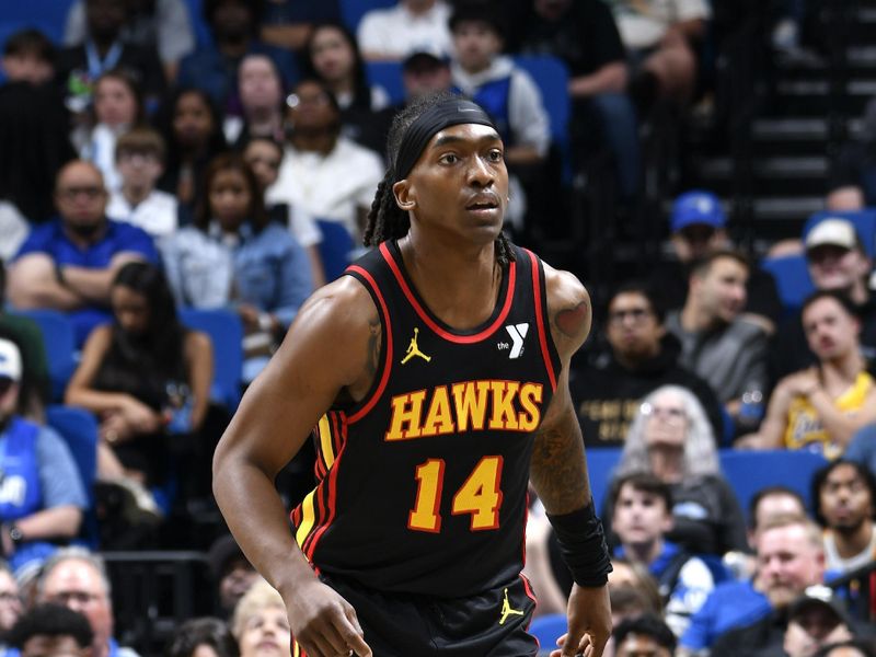 ORLANDO, FL - FEBRUARY 10: Terance Mann #14 of the Atlanta Hawks looks on during the game against the Orlando Magic on February 10, 2025 at Kia Center in Orlando, Florida. NOTE TO USER: User expressly acknowledges and agrees that, by downloading and or using this photograph, User is consenting to the terms and conditions of the Getty Images License Agreement. Mandatory Copyright Notice: Copyright 2025 NBAE (Photo by Fernando Medina/NBAE via Getty Images)