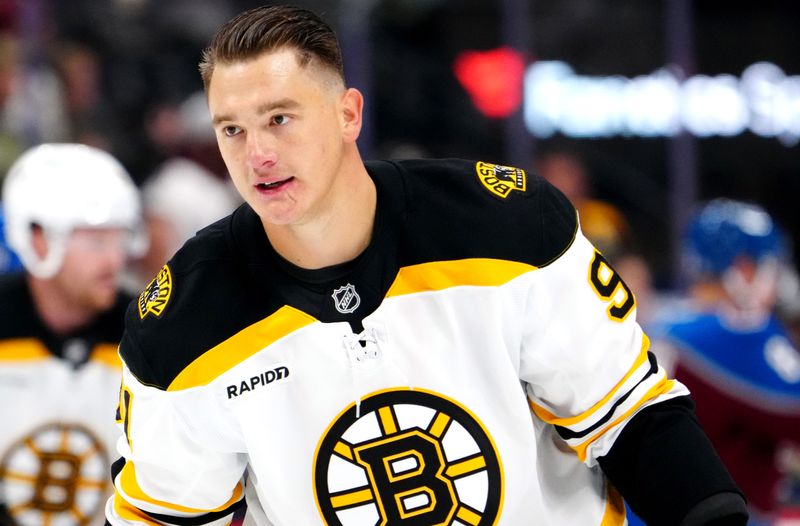 Oct 16, 2024; Denver, Colorado, USA; Boston Bruins defenseman Nikita Zadorov (91) before the game against the Colorado Avalanche at Ball Arena. Mandatory Credit: Ron Chenoy-Imagn Images