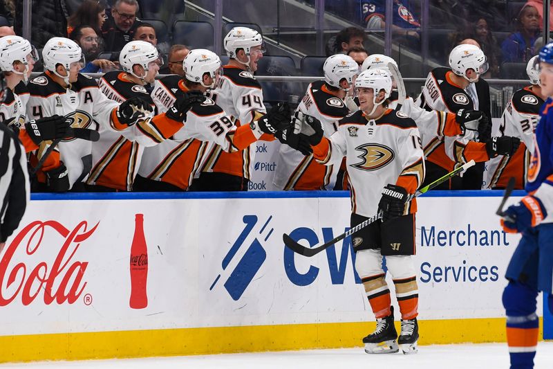 Dec 13, 2023; Elmont, New York, USA; Anaheim Ducks right wing Troy Terry (19) celebrates his goal against the New York Islanders with the Anaheim Ducks bench during the second period at UBS Arena. Mandatory Credit: Dennis Schneidler-USA TODAY Sports