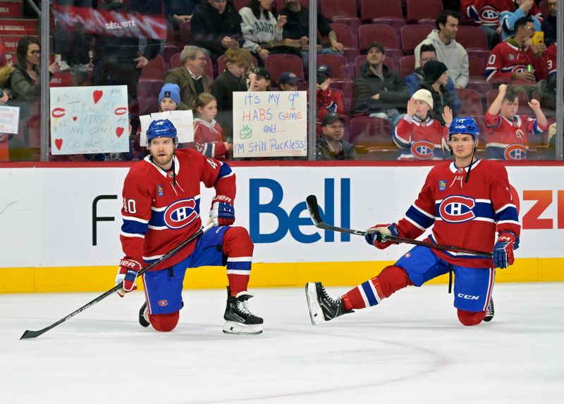 Feb 27, 2025; Montreal, Quebec, CAN; Montreal Canadiens forward Joel Armia (40) and teammate forward Jake Evans (71) stretch during the warmup period before the game against the San Jose Sharks at the Bell Centre. Mandatory Credit: Eric Bolte-Imagn Images