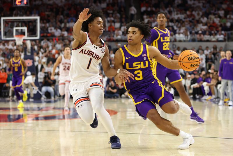 Jan 13, 2024; Auburn, Alabama, USA; Auburn Tigers guard Aden Holloway (1) pressures LSU Tigers guard Jalen Cook (3) during the first half at Neville Arena. Mandatory Credit: John Reed-USA TODAY Sports