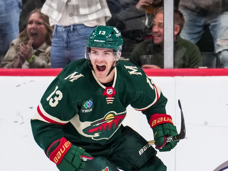 Oct 15, 2022; Saint Paul, Minnesota, USA; Minnesota Wild center Sam Steel (13) celebrates his goal during the third period against the Los Angeles Kings at Xcel Energy Center. Mandatory Credit: Brace Hemmelgarn-USA TODAY Sports