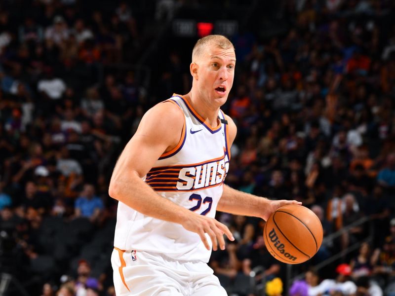 PHOENIX, AZ - OCTOBER 11: Mason Plumlee #22 of the Phoenix Suns dribbles the ball during the game against the Detroit Pistons during a NBA preseason game on October 11, 2024 at Footprint Center in Phoenix, Arizona. NOTE TO USER: User expressly acknowledges and agrees that, by downloading and or using this photograph, user is consenting to the terms and conditions of the Getty Images License Agreement. Mandatory Copyright Notice: Copyright 2024 NBAE (Photo by Barry Gossage/NBAE via Getty Images)