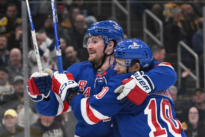 Mar 21, 2024; Boston, Massachusetts, USA; New York Rangers left wing Artemi Panarin (10) celebrates with left wing Alexis Lafreniere (13) after scoring a goal against the Boston Bruins during the second period at the TD Garden. Mandatory Credit: Brian Fluharty-USA TODAY Sports