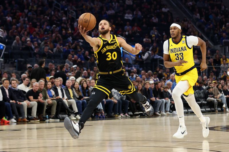 SAN FRANCISCO, CALIFORNIA - MARCH 22: Stephen Curry #30 of the Golden State Warriors reaches for a pass in front of Myles Turner #33 of the Indiana Pacers in the first half at Chase Center on March 22, 2024 in San Francisco, California. NOTE TO USER: User expressly acknowledges and agrees that, by downloading and or using this photograph, User is consenting to the terms and conditions of the Getty Images License Agreement.  (Photo by Ezra Shaw/Getty Images)