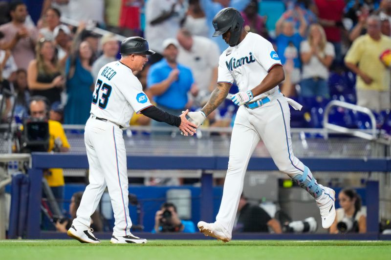 Sep 17, 2023; Miami, Florida, USA; Miami Marlins designated hitter Jorge Soler (12) celebrates hitting a home run against the Atlanta Braves during the sixth inning at loanDepot Park. Mandatory Credit: Rich Storry-USA TODAY Sports