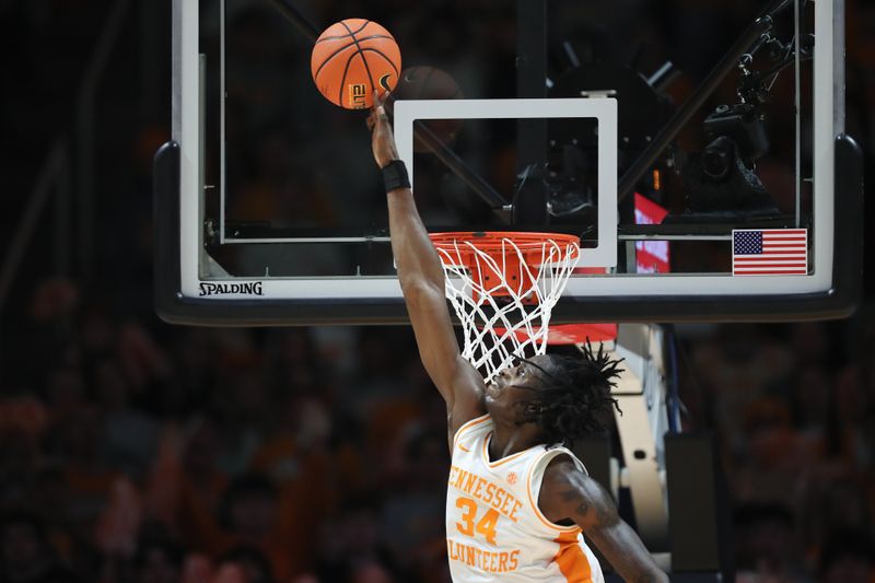 Jan 28, 2025; Knoxville, Tennessee, USA; Tennessee Volunteers forward Felix Okpara (34) blocks a Kentucky Wildcats shot during the first half at Thompson-Boling Arena at Food City Center. Mandatory Credit: Randy Sartin-Imagn Images