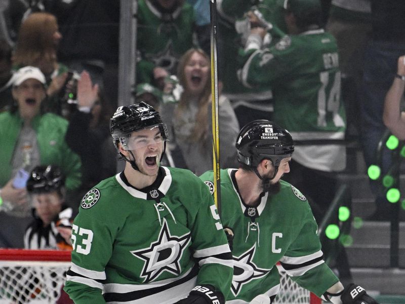 Apr 28, 2025; Dallas, Texas, USA; Dallas Stars left wing Jamie Benn (14) and center Wyatt Johnston (53) celebrates a goal scored by Dallas Stars defenseman Cody Ceci (not pictured) during the first period against the Colorado Avalanche in game five of the first round of the 2025 Stanley Cup Playoffs at American Airlines Center. Mandatory Credit: Jerome Miron-Imagn Images