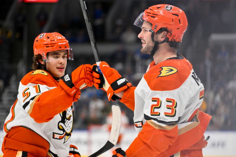 Dec 1, 2025; St. Louis, Missouri, USA; Anaheim Ducks center Mason McTavish (23) is congratulated by defenseman Olen Zellweger (51) after scoring against the St. Louis Blues during the first period at Enterprise Center. Mandatory Credit: Jeff Curry-Imagn Images