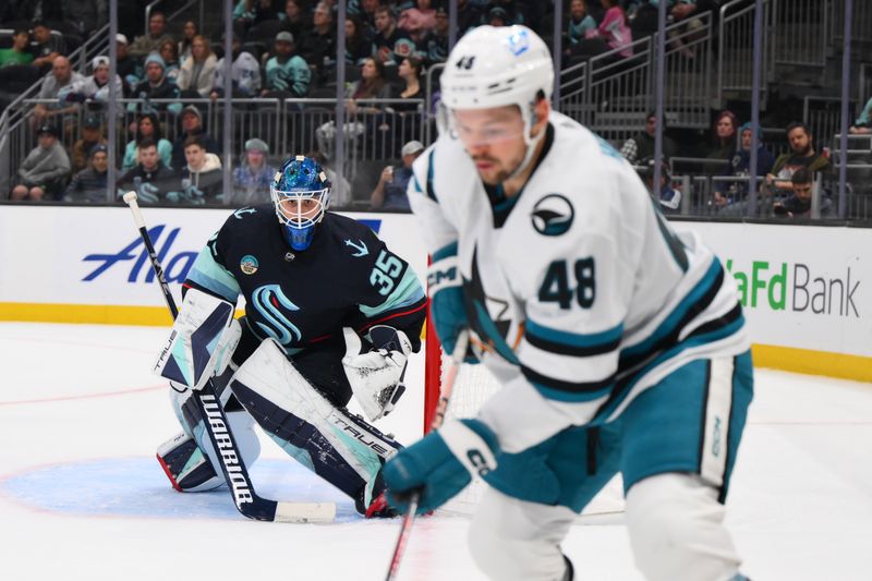 Nov 22, 2023; Seattle, Washington, USA; Seattle Kraken goaltender Joey Daccord (35) defends the goal against the San Jose Sharks during the first period at Climate Pledge Arena. Mandatory Credit: Steven Bisig-USA TODAY Sports