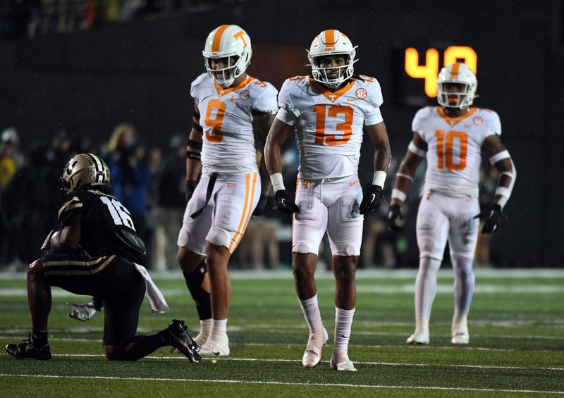 Nov 26, 2022; Nashville, Tennessee, USA; Tennessee Volunteers defensive back Wesley Walker (13) after a defensive stop against Vanderbilt Commodores wide receiver Jayden McGowan (16) during the first half at FirstBank Stadium. Mandatory Credit: Christopher Hanewinckel-USA TODAY Sports