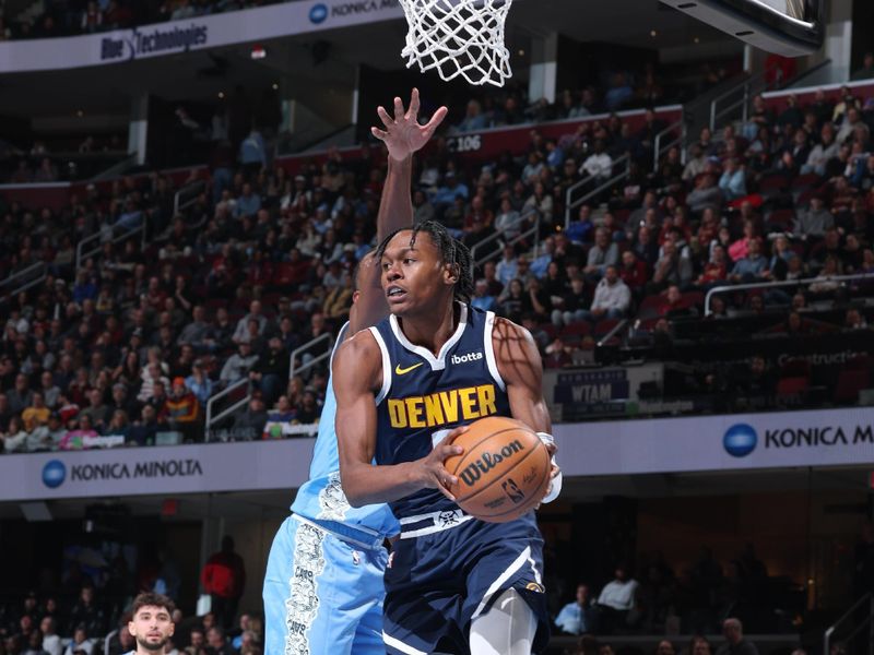 CLEVELAND, OH - DECEMBER 5: Peyton Watson #8 of the Denver Nuggets drives to the basket during the game against the Cleveland Cavaliers on December 5, 2024 at Rocket Mortgage FieldHouse in Cleveland, Ohio. NOTE TO USER: User expressly acknowledges and agrees that, by downloading and or using this photograph, User is consenting to the terms and conditions of the Getty Images License Agreement. Mandatory Copyright Notice: Copyright 2024 NBAE (Photo by Jeff Haynes/NBAE via Getty Images)