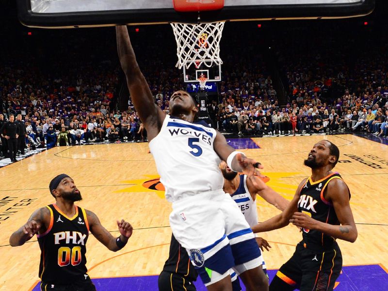 PHOENIX, AZ - APRIL  26: Anthony Edwards #5 of the Minnesota Timberwolves drives to the basket during the game against the Phoenix Suns on April 26, 2024 at Footprint Center in Phoenix, Arizona. NOTE TO USER: User expressly acknowledges and agrees that, by downloading and or using this photograph, user is consenting to the terms and conditions of the Getty Images License Agreement. Mandatory Copyright Notice: Copyright 2024 NBAE (Photo by Kate Frese/NBAE via Getty Images)